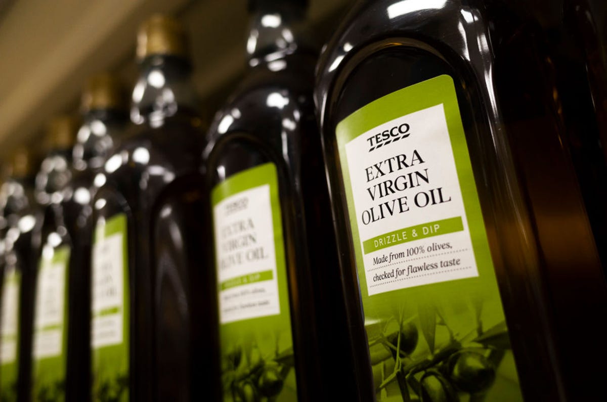 Bottles of olive oil on a supermarket shelves