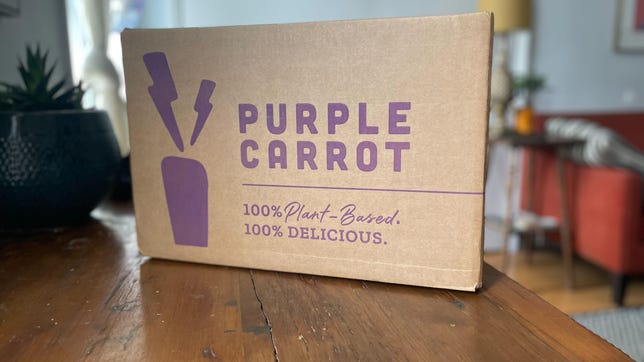purple carrot box on table