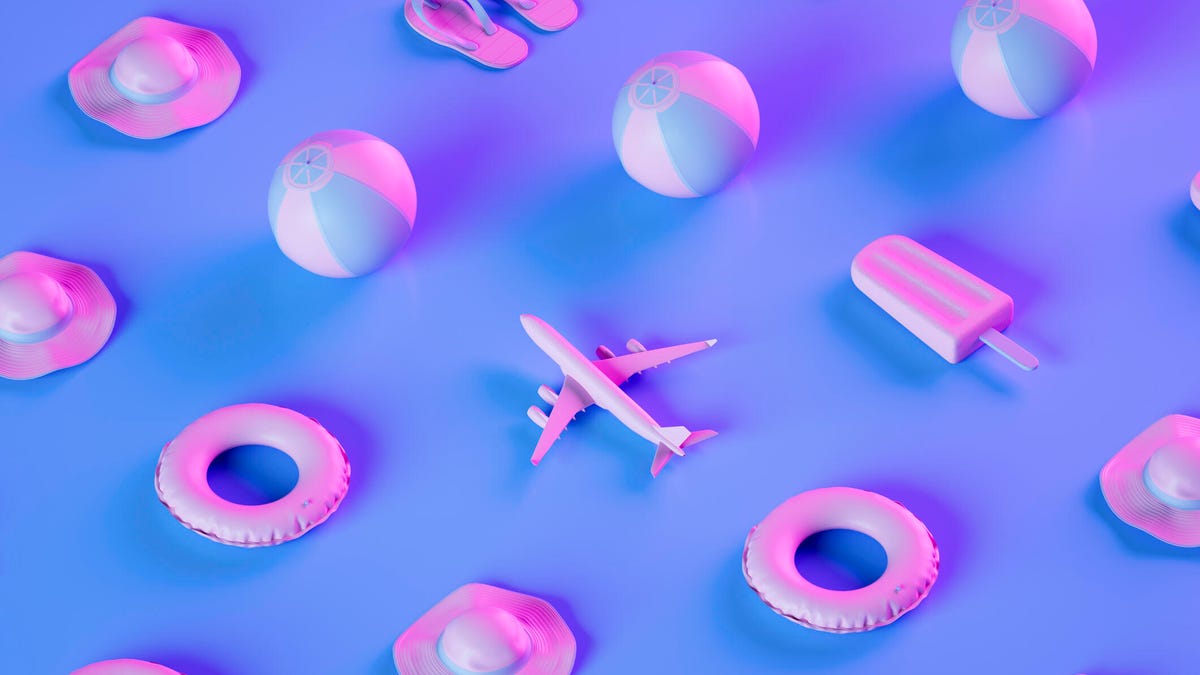 An image of planes, beach balls, flotation rings, popsicles and flip flops on a purple and pink background gettyimages-1486013518