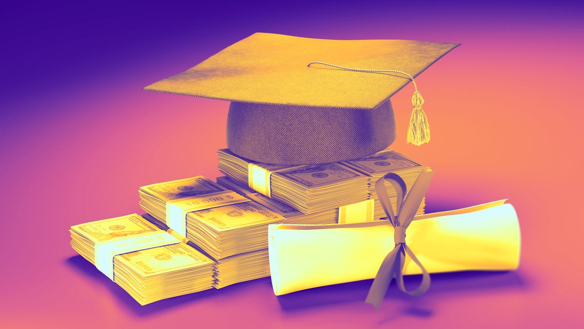Graduation cap on top of pile of money